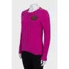 Pink sweater with embroidery