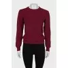Red sweater with a tag