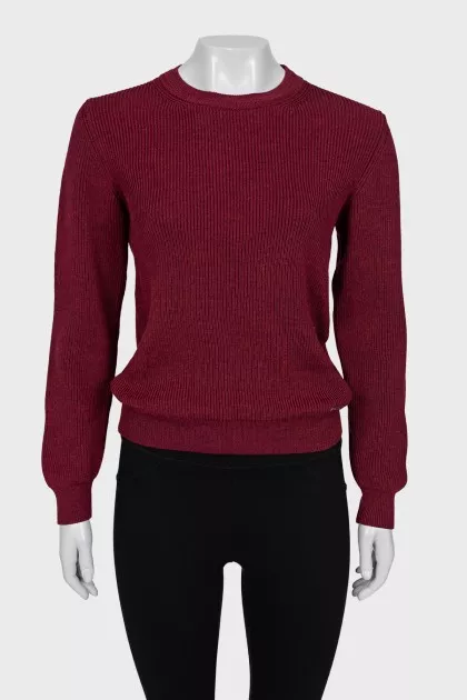 Red sweater with a tag