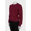 Red sweater with a tag