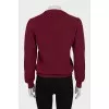 Red sweater with a tag