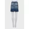 Denim mini skirt with buttons and decoration