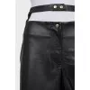Faux leather trousers with a cutout