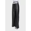 Faux leather trousers with a cutout