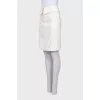White skirt with a wide belt