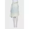 Asymmetrical denim skirt with buttons