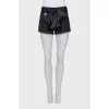 Short shorts with a silk belt