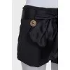 Short shorts with a silk belt