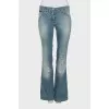 Light blue flared jeans with distressing
