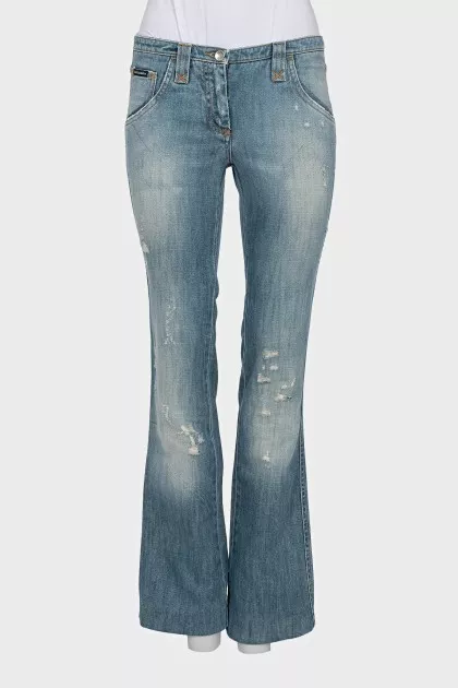 Light blue flared jeans with distressing