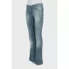 Light blue flared jeans with distressing