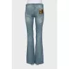 Light blue flared jeans with distressing