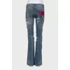 Flared jeans with embroidery and beads