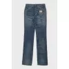 Low-rise straight leg jeans with distressing