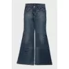 Flared jeans with a distressed effect