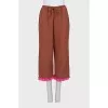 A ruffled cropped pants and top suit