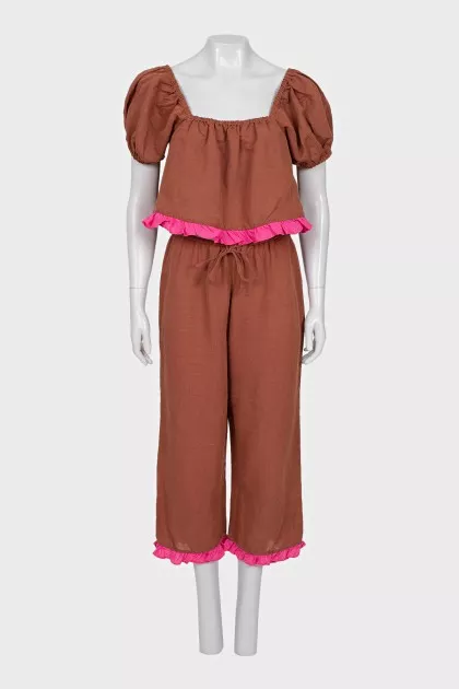 A ruffled cropped pants and top suit