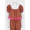 A ruffled cropped pants and top suit