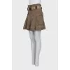 Skirt with a frill decorated with an eyelet
