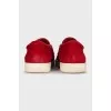 Suede slip-ons with gold decor