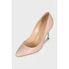 Beige leather pumps