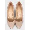 Beige leather pumps