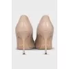 Beige leather pumps