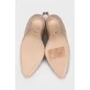 Beige leather pumps
