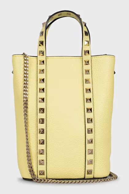 Yellow leather bag with studs