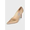 Beige textured leather pumps