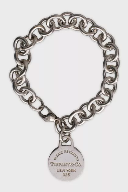 Silver bracelet with signature charm
