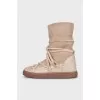 Suede boots with decorative laces