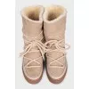 Suede boots with decorative laces