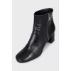 Black ankle boots with a trapezoid heel