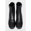 Black ankle boots with a trapezoid heel