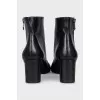 Black ankle boots with a trapezoid heel