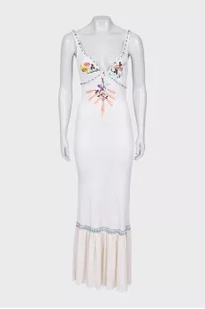 A fitted dress decorated with embroidery and beads