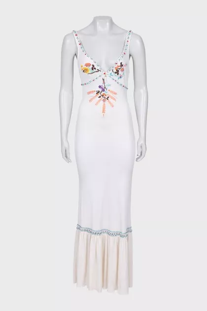 A fitted dress decorated with embroidery and beads