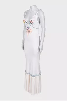 A fitted dress decorated with embroidery and beads