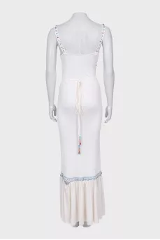 A fitted dress decorated with embroidery and beads