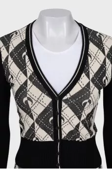 A suit consisting of a button-down cardigan and trousers