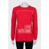 Red sweatshirt with a signature print