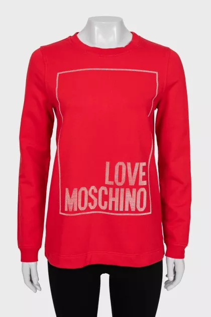 Red sweatshirt with a signature print