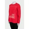 Red sweatshirt with a signature print
