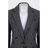 Fitted coat decorated with sequins