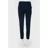 Narrowed trousers of high landing