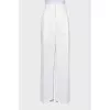 White trousers with a double belt