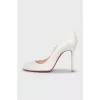 White leather pumps