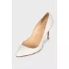 White leather pumps