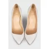 White leather pumps